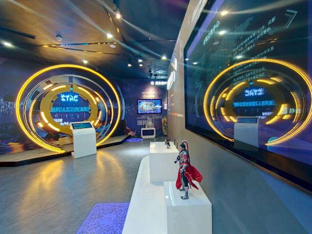 (260724) -- CHENGDU, July 24, 2026 (Xinhua) -- This photo taken on July 22, 2026 shows an exhibition hall in Tianfu Long Island Digital Cultural and Creative Park in Chengdu, southwest China's Sichuan Province. The animated film "All Wishes Come True" released nationwide recently has won praise for its fresh take on Chinese mythology and stunning visual effects. Following the resounding success of animation film series of "Ne Zha," it is another blockbuster developed at Tianfu Long Island Digital Cultural and Creative Park under the Chengdu High-Tech Industrial Development Zone. 
   The park is home to more than 70 digital cultural and creative enterprises covering sectors such as animation, game development and esports. The Chengdu High-Tech Industrial Development Zone, for its part, now hosts more than 6,000 companies in the digital cultural and creative industry, reflecting the city's rapidly growing creative economy. (Xinhua/Bao Feifei)