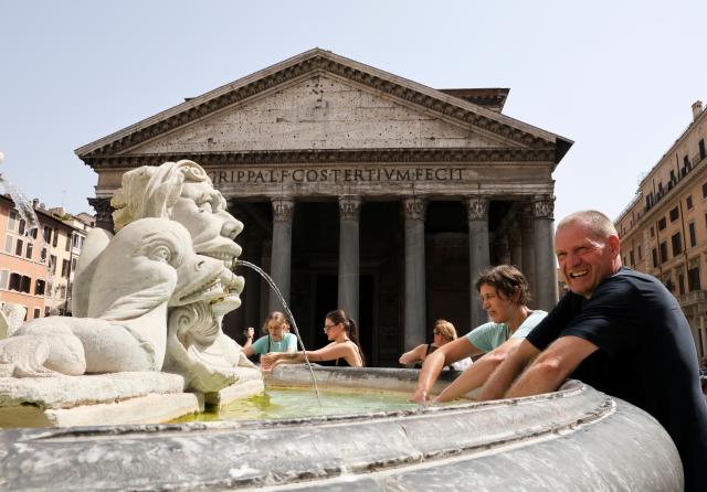 (260724) -- ROME, July 24, 2026 (Xinhua) -- Tourists cool off at the Fontana del Pantheon during a heatwave in Rome, Italy, July 19, 2026. A new round of extreme heat is tightening its grip on Europe from the Mediterranean to Scandinavia, setting local temperature records and fueling wildfires, violent storms and growing safety risks. Weeks of scorching temperatures and scarce rainfall have also pushed major rivers to historic lows, disrupting shipping, industry and agriculture, while forecasters warn another heat surge could arrive around the turn of the month. 
   TO GO WITH "Roundup: Extreme heat tests Europe as fires spread and rivers run low" (Xinhua/Li Jing)