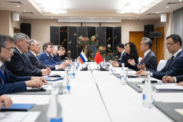 (260724) -- CHOLPON-ATA, July 24, 2026 (Xinhua) -- Chinese Foreign Minister Wang Yi, also a member of the Political Bureau of the Communist Party of China Central Committee, meets with Russian Foreign Minister Sergey Lavrov on the sidelines of the Meeting of the Council of the Ministers of Foreign Affairs of the Shanghai Cooperation Organization (SCO) Member States in Kyrgyzstan, July 24, 2026. (Xinhua/Li Renzi)