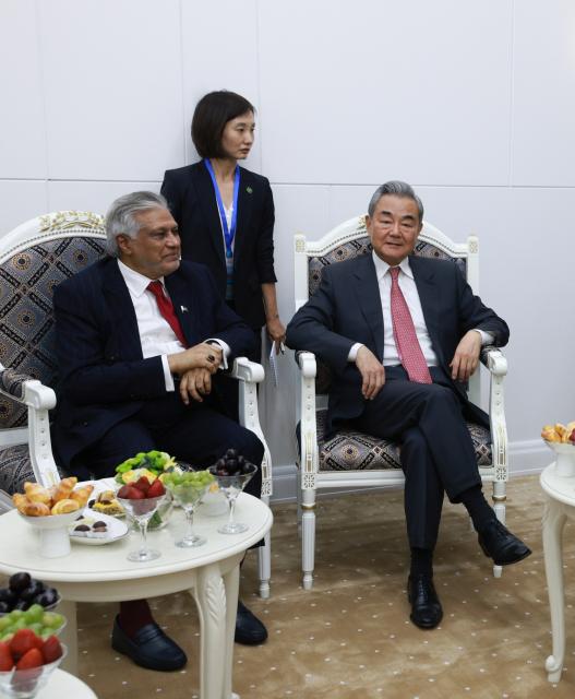 (260724) -- CHOLPON-ATA, July 24, 2026 (Xinhua) -- Chinese Foreign Minister Wang Yi, also a member of the Political Bureau of the Communist Party of China Central Committee, meets with Pakistani Deputy Prime Minister and Foreign Minister Mohammad Ishaq Dar on the sidelines of the Meeting of the Council of the Ministers of Foreign Affairs of the Shanghai Cooperation Organization (SCO) Member States in Kyrgyzstan, July 24, 2026. (Photo by Roman/Xinhua)