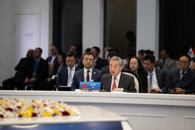 (260724) -- CHOLPON-ATA, July 24, 2026 (Xinhua) -- Chinese Foreign Minister Wang Yi, also a member of the Political Bureau of the Communist Party of China (CPC) Central Committee, attends the Meeting of the Council of the Ministers of Foreign Affairs of the Shanghai Cooperation Organization (SCO) Member States in Kyrgyzstan, July 24, 2026. Foreign ministers of SCO member states, the SCO secretary-general, and the director of the Executive Committee of the SCO Regional Anti-Terrorist Structure also attended the meeting. (Xinhua/Li Renzi)