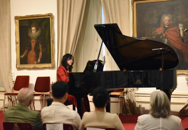 (260725) -- VIENNA, July 25, 2026 (Xinhua) -- Chinese pianist Xie Jingxian, an associate professor at the Shanghai Conservatory of Music, performs during a Chinese piano recital in Vienna, Austria, July 23, 2026. TO GO WITH ''Feature: Chinese piano recital in Vienna opens window onto Eastern musical aesthetics'' (Xinhua/He Canling)