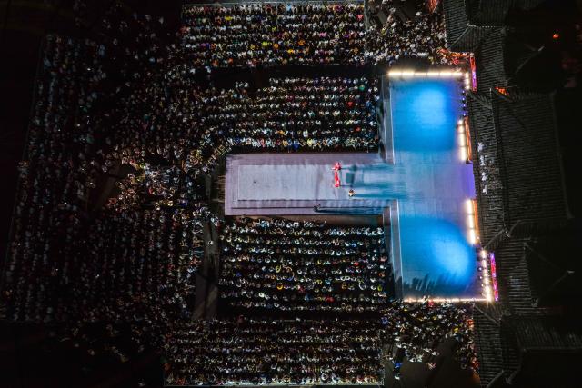 (260725) -- BEIJING, July 25, 2026 (Xinhua) -- An aerial drone photo taken on July 23, 2026 shows the venue of the "Village T" fashion show in Kaili, Qiandongnan Miao and Dong Autonomous Prefecture, southwest China's Guizhou Province. A celebration event marking the second anniversary of the "Village T" fashion show was held here on Thursday. Teams from across China came to showcase the beauty of ethnic costumes and the charm of intangible cultural heritage, attracting large numbers of visitors. (Xinhua/Yang Wenbin)