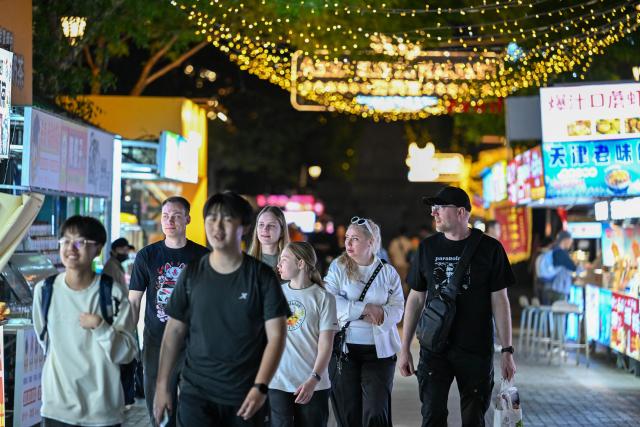 (260725) -- TIANJIN, July 25, 2026 (Xinhua) -- Russian tourists visit the Italian Style Area in Tianjin, north China, April 24, 2026. TO GO WITH "China Focus: Chinese youth shape consumer trends with growing global appeal" (Xinhua/Sun Fanyue)