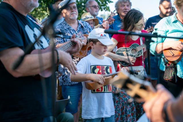 (260725) -- PRAGUE, July 25, 2026 (Xinhua) -- People perform at the 14th Czech Ukulele Festival in Prague, the Czech Republic, July 24, 2026. The 14th Czech Ukulele Festival, running from July 24 to 26, features public performances, concerts and music workshops. (Photo by Dana Kesnerova/Xinhua)