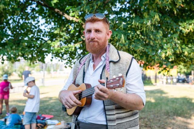 (260725) -- PRAGUE, July 25, 2026 (Xinhua) -- A man plays the ukulele at the 14th Czech Ukulele Festival in Prague, the Czech Republic, July 24, 2026. The 14th Czech Ukulele Festival, running from July 24 to 26, features public performances, concerts and music workshops. (Photo by Dana Kesnerova/Xinhua)