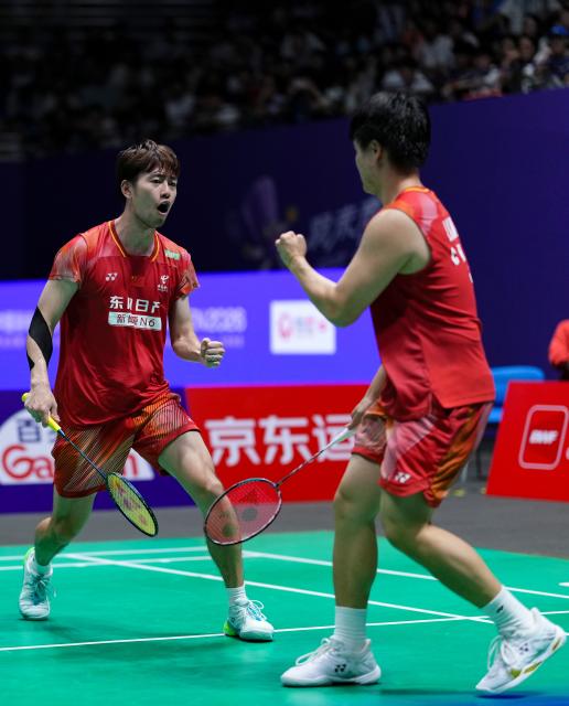 (260725) -- CHANGZHOU, July 25, 2026 (Xinhua) -- Liang Weikeng/Wang Chang (L) celebrate a score during the men's doubles semifinal match between Liang Weikeng/Wang Chang of China and Fajar Alfian/Muhammad Shohibul Fikri of Indonesia at the China Open 2026 badminton tournament in Changzhou, east China's Jiangsu Province, July 25, 2026. (Xinhua/Sun Fei)