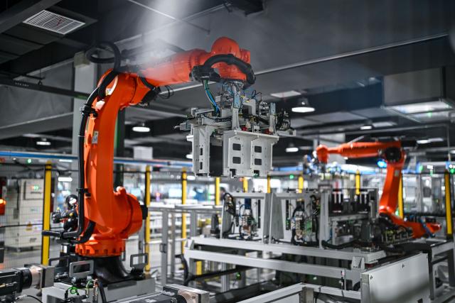 (260725) -- NANTONG, July 25, 2026 (Xinhua) -- Robotic arms work in an energy storage production workshop at the Sigenergy Nantong Smart Energy Center in Nantong, east China's Jiangsu Province, July 24, 2026. Unlike traditional factories, Sigenergy has achieved a leap from "single-point automation" to "full-process collaborative intelligence." Every key piece of equipment here is connected to the industrial internet, realizing the practical integration of "AI plus energy."
   Sigenergy is one of the Chinese new energy enterprises who are adhering to technological innovation and actively reshaping the new pattern of intelligent manufacturing. (Xinhua/Chen Yehua)