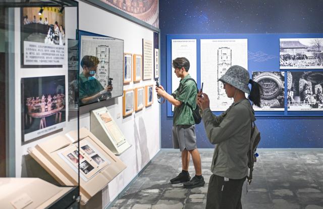 (260725) -- BEIJING, July 25, 2026 (Xinhua) -- Journalists visit an exhibition, scheduled to open on July 27, during a press preview at Beijing Ancient Architecture Museum inside the Altar of the God of Agriculture, also referred to as the Xiannongtan Temple, in Beijing, capital of China, July 24, 2026. Marking the second anniversary of the successful inscription of the Beijing Central Axis on the UNESCO World Heritage List, heritage sites along the Beijing Central Axis, such as the Palace Museum, Zhengyangmen Gate, and Altar of the God of Agriculture, also referred to as the Xiannongtan Temple, will either open to the public free of charge or launch new exhibitions on July 27.
  Over the past two years, efforts to conserve, inherit and make good use of the Beijing Central Axis have advanced steadily, achieving new outcomes in areas including related legal system, UNESCO World Heritage signage, landscape improvement, creative utilization, collaborative protection and international communication. (Xinhua/Chen Zhonghao)