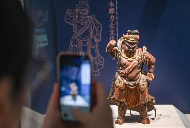 (260725) -- BEIJING, July 25, 2026 (Xinhua) -- An exhibit is pictured at an exhibition, scheduled to open on July 27, at Beijing Ancient Architecture Museum inside the Altar of the God of Agriculture, also referred to as the Xiannongtan Temple, in Beijing, capital of China, July 24, 2026. Marking the second anniversary of the successful inscription of the Beijing Central Axis on the UNESCO World Heritage List, heritage sites along the Beijing Central Axis, such as the Palace Museum, Zhengyangmen Gate, and Altar of the God of Agriculture, also referred to as the Xiannongtan Temple, will either open to the public free of charge or launch new exhibitions on July 27.
  Over the past two years, efforts to conserve, inherit and make good use of the Beijing Central Axis have advanced steadily, achieving new outcomes in areas including related legal system, UNESCO World Heritage signage, landscape improvement, creative utilization, collaborative protection and international communication. (Xinhua/Chen Zhonghao)