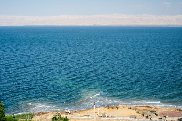 (260726) -- AMMAN, July 26, 2026 (Xinhua) -- This photo taken on July 25, 2026 shows a view of the Dead Sea in Jordan. The Dead Sea has been experiencing a long-term decline in its water level due to reduced inflow from the Jordan River, the region's naturally high evaporation rates, and industrial mineral extraction. Available data show that as of July 2026, the Dead Sea's surface was approximately 440 meters below sea level, and its water level has been declining by an average of more than one meter annually. (Xinhua/Xin Mengchen)