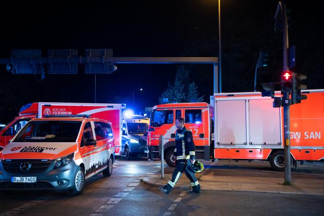 (260726) -- BERLIN, July 26, 2026 (Xinhua) -- A rescuer works near the site where a car drove into a crowd in Berlin, Germany, July 26, 2026. One person was killed and 16 others were injured, including several with life-threatening injuries, after a car drove into a crowd at a large Pride celebration in central Berlin on Saturday evening, a police spokesperson said. (Xinhua/Zhang Haofu)