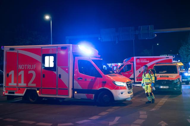 (260726) -- BERLIN, July 26, 2026 (Xinhua) -- Rescuers work near the site where a car drove into a crowd in Berlin, Germany, July 26, 2026. One person was killed and 16 others were injured, including several with life-threatening injuries, after a car drove into a crowd at a large Pride celebration in central Berlin on Saturday evening, a police spokesperson said. (Xinhua/Zhang Haofu)