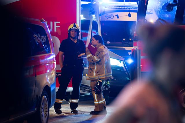 (260726) -- BERLIN, July 26, 2026 (Xinhua) -- Rescuers work near the site where a car drove into a crowd in Berlin, Germany, July 26, 2026. One person was killed and 16 others were injured, including several with life-threatening injuries, after a car drove into a crowd at a large Pride celebration in central Berlin on Saturday evening, a police spokesperson said. (Xinhua/Zhang Haofu)