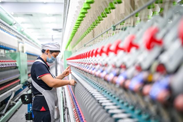 (260726) -- YANCHENG, July 26, 2026 (Xinhua) -- An employee works at a factory in Jiangsu Yueda Textile Group Co., Ltd. in Yancheng City, east China's Jiangsu Province, July 25, 2026. Jiangsu Yueda Textile Group Co., Ltd. has been recognized as a "Global Lighthouse Factory" due to its recent advancements in intelligent, digital, and green transformations, which have enhanced production efficiency and product quality.
  In recent years, Yancheng has focused on intelligent manufacturing and industrial upgrading in its industrial enterprises. By promoting technological innovation and optimizing the industrial chain, the city has forged a new path of high-quality development. (Xinhua/Chen Yehua)