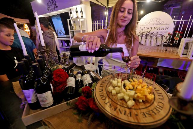 (260726) -- DHOUR CHOUEIR, July 26, 2026 (Xinhua) -- People attend a wine festival held in Dhour Choueir, Lebanon, on July 25, 2026. (Xinhua/Bilal Jawich)