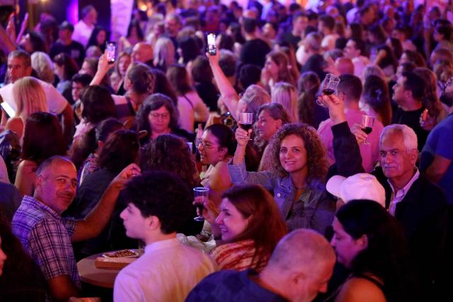 (260726) -- DHOUR CHOUEIR, July 26, 2026 (Xinhua) -- People attend a wine festival held in Dhour Choueir, Lebanon, on July 25, 2026. (Xinhua/Bilal Jawich)
