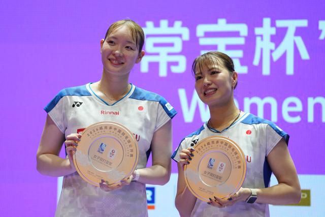 (260726) -- CHANGZHOU, July 26, 2026 (Xinhua) -- Fukushima Yuki (R)/Matsumoto Mayu of Japan pose for photos during the awarding ceremony of the women's doubles at the 2026 China Open badminton tournament in Changzhou, east China's Jiangsu Province, July 26, 2026. (Xinhua/Sun Fei)