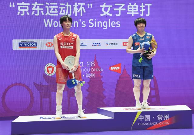 (260726) -- CHANGZHOU, July 26, 2026 (Xinhua) -- Gold medalist Yamaguchi Akane (R) and silver medalist Chen Yufei pose on the podium during the awarding ceremony after the women's singles final match between Chen Yufei of China and Yamaguchi Akane of Japan at the 2026 China Open badminton tournament in Changzhou, east China's Jiangsu Province, July 26, 2026. (Xinhua/Li Bo)