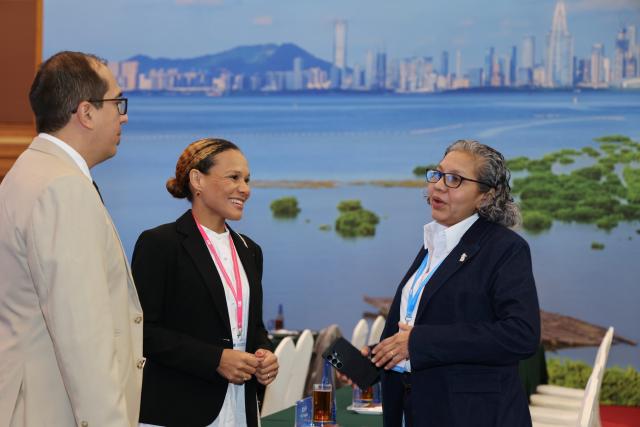 (260726) -- SHENZHEN, July 26, 2026 (Xinhua) -- Representatives talk at the venue of the first council meeting of the International Mangrove Center in Shenzhen, south China's Guangdong Province, July 26, 2026.
  The first council meeting and inauguration ceremony of the International Mangrove Center was held here on Sunday. Representatives from member states, signatory countries and observer institutions of the center attended the meeting, during which a series of institutional documents including the strategic plan and rules of procedure have been reviewed and adopted, and the Secretary-General of the International Mangrove Center was appointed. The Secretariat of the center is officially settled in Shenzhen. (Xinhua/Liang Xu)
