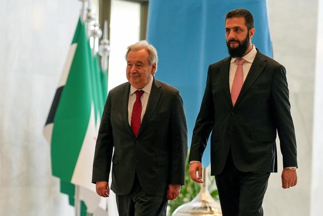 (260726) -- DAMASCUS, July 26, 2026 (Xinhua) -- UN Secretary-General Antonio Guterres is welcomed by Syria's interim leader Ahmad al-Sharaa in Damascus, Syria, July 25, 2026. Guterres visited Syria on Saturday, pledging continued UN support for the country's recovery and reconstruction in the first visit by a UN chief to Damascus since 2009. (Xinhua)
