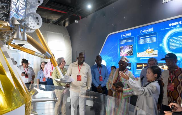 (260726) -- HAIKOU, July 26, 2026 (Xinhua) -- Diplomatic envoys visit the Wenchang Aerospace Science Center in Wenchang, south China's Hainan Province, July 24, 2026. At the invitation of the Chinese Ministry of Foreign Affairs, more than 30 ambassadors and senior diplomats visited Sanya, Wuzhishan, Qionghai, Wenchang and Haikou in south China's Hainan Province from Wednesday to Saturday. During the visit, they explored Hainan's scientific and technological innovation, and the development of the Hainan Free Trade Port. (Xinhua/Yang Guanyu)