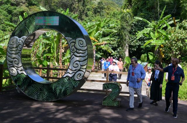 (260726) -- HAIKOU, July 26, 2026 (Xinhua) -- Diplomatic envoys visit the Wuzhishan section of the Hainan Tropical Rainforest National Park in south China's Hainan Province, July 23, 2026. At the invitation of the Chinese Ministry of Foreign Affairs, more than 30 ambassadors and senior diplomats visited Sanya, Wuzhishan, Qionghai, Wenchang and Haikou in south China's Hainan Province from Wednesday to Saturday. During the visit, they explored Hainan's scientific and technological innovation, and the development of the Hainan Free Trade Port. (Xinhua/Yang Guanyu)