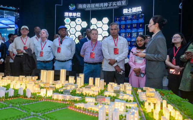 (260726) -- HAIKOU, July 26, 2026 (Xinhua) -- Diplomatic envoys visit Yazhou Bay Science and Technology City in Sanya, south China's Hainan Province, July 22, 2026. At the invitation of the Chinese Ministry of Foreign Affairs, more than 30 ambassadors and senior diplomats visited Sanya, Wuzhishan, Qionghai, Wenchang and Haikou in south China's Hainan Province from Wednesday to Saturday. During the visit, they explored Hainan's scientific and technological innovation, and the development of the Hainan Free Trade Port. (Xinhua/Yang Guanyu)