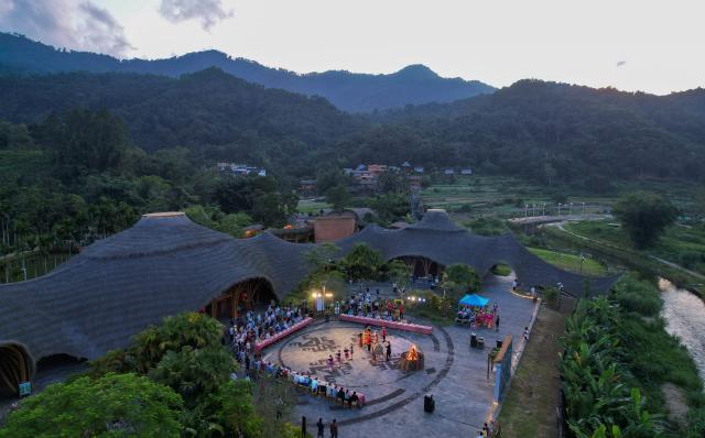 (260726) -- HAIKOU, July 26, 2026 (Xinhua) -- An aerial drone photo taken on July 23, 2026 shows diplomatic envoys attending a banquet in Maona Village of Shuiman Township, Wuzhishan City, south China's Hainan Province. At the invitation of the Chinese Ministry of Foreign Affairs, more than 30 ambassadors and senior diplomats visited Sanya, Wuzhishan, Qionghai, Wenchang and Haikou in south China's Hainan Province from Wednesday to Saturday. During the visit, they explored Hainan's scientific and technological innovation, and the development of the Hainan Free Trade Port. (Xinhua/Yang Guanyu)