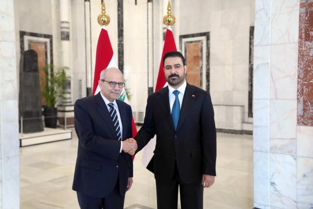 (260726) -- BAGHDAD, July 26, 2026 (Xinhua) -- Iraqi Prime Minister Ali al-Zaidi (R) shakes hands with visiting Lebanese Prime Minister Nawaf Salam in Baghdad, Iraq, July 26, 2026. Iraqi Prime Minister Ali al-Zaidi met here on Sunday with his visiting Lebanese counterpart Nawaf Salam on strengthening bilateral cooperation and promoting regional stability, according to a statement from al-Zaidi's media office. (Iraqi Prime Minister Media Office/Handout via Xinhua)