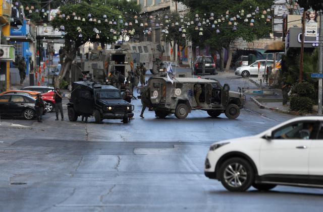 (260726) -- NABLUS, July 26, 2026 (Xinhua) -- Israeli military vehicles are seen during a military operation in Nablus in the northern West Bank, July 26, 2026. (Photo by Ayman Nobani/Xinhua)