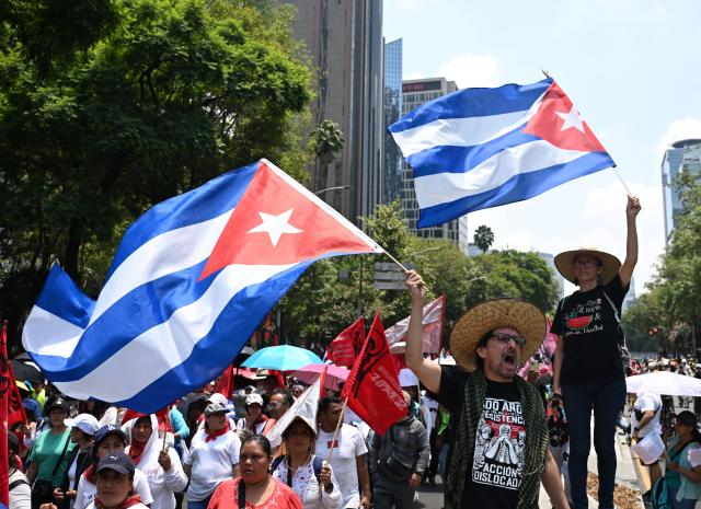 (260726) -- MEXICO CITY, July 26, 2026 (Xinhua) -- Protesters march during a demonstration in support of Cuba and against U.S. embargo on Cuba, in Mexico City, Mexico on July 26, 2026. The demonstration aimed to commemorate the 73rd anniversary of the assault on Moncada and Carlos Manuel de Cespedes garrisons that took place on July 26, 1953, seen as the beginning of the Cuban Revolution. (Xinhua/Wu Wei)