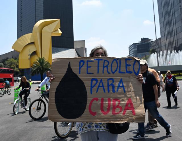 (260726) -- MEXICO CITY, July 26, 2026 (Xinhua) -- Protesters march during a demonstration in support of Cuba and against U.S. embargo on Cuba, in Mexico City, Mexico on July 26, 2026. The demonstration aimed to commemorate the 73rd anniversary of the assault on Moncada and Carlos Manuel de Cespedes garrisons that took place on July 26, 1953, seen as the beginning of the Cuban Revolution. (Xinhua/Wu Wei)