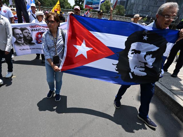 (260726) -- MEXICO CITY, July 26, 2026 (Xinhua) -- Protesters march during a demonstration in support of Cuba and against U.S. embargo on Cuba, in Mexico City, Mexico on July 26, 2026. The demonstration aimed to commemorate the 73rd anniversary of the assault on Moncada and Carlos Manuel de Cespedes garrisons that took place on July 26, 1953, seen as the beginning of the Cuban Revolution. (Xinhua/Wu Wei)