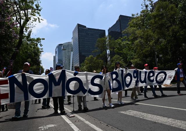 (260726) -- MEXICO CITY, July 26, 2026 (Xinhua) -- Protesters march during a demonstration in support of Cuba and against U.S. embargo on Cuba, in Mexico City, Mexico on July 26, 2026. The demonstration aimed to commemorate the 73rd anniversary of the assault on Moncada and Carlos Manuel de Cespedes garrisons that took place on July 26, 1953, seen as the beginning of the Cuban Revolution. (Xinhua/Wu Wei)