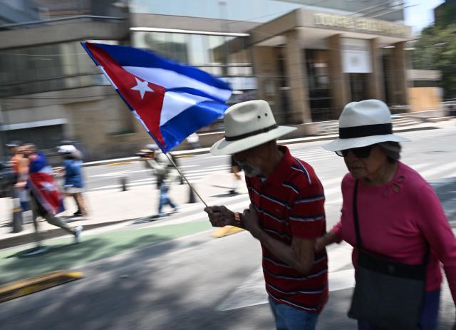 (260726) -- MEXICO CITY, July 26, 2026 (Xinhua) -- Protesters march during a demonstration in support of Cuba and against U.S. embargo on Cuba, in Mexico City, Mexico on July 26, 2026. The demonstration aimed to commemorate the 73rd anniversary of the assault on Moncada and Carlos Manuel de Cespedes garrisons that took place on July 26, 1953, seen as the beginning of the Cuban Revolution. (Xinhua/Wu Wei)