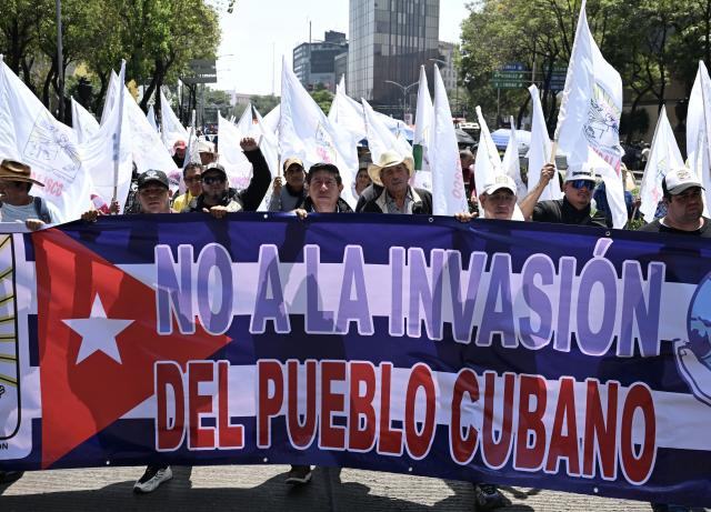(260726) -- MEXICO CITY, July 26, 2026 (Xinhua) -- Protesters march during a demonstration in support of Cuba and against U.S. embargo on Cuba, in Mexico City, Mexico on July 26, 2026. The demonstration aimed to commemorate the 73rd anniversary of the assault on Moncada and Carlos Manuel de Cespedes garrisons that took place on July 26, 1953, seen as the beginning of the Cuban Revolution. (Xinhua/Wu Wei)
