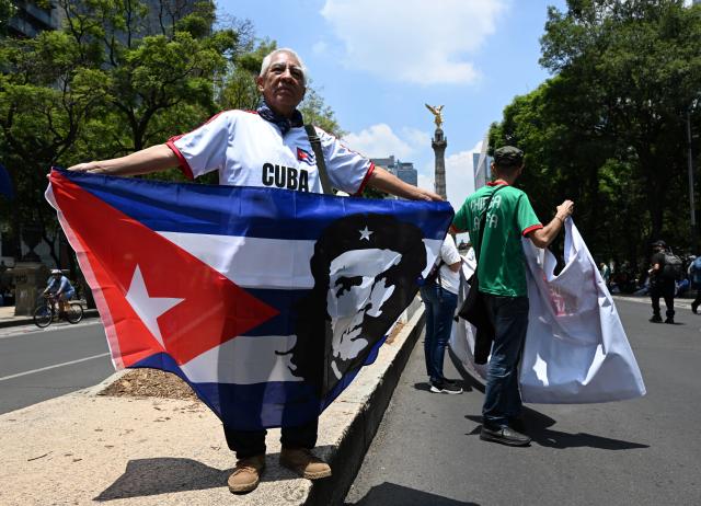(260726) -- MEXICO CITY, July 26, 2026 (Xinhua) -- Protesters march during a demonstration in support of Cuba and against U.S. embargo on Cuba, in Mexico City, Mexico on July 26, 2026. The demonstration aimed to commemorate the 73rd anniversary of the assault on Moncada and Carlos Manuel de Cespedes garrisons that took place on July 26, 1953, seen as the beginning of the Cuban Revolution. (Xinhua/Wu Wei)