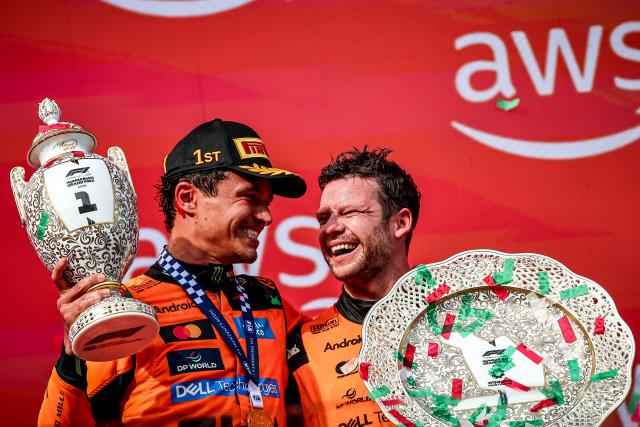 (260727) -- MOGYOROD, July 27, 2026 (Xinhua) -- McLaren's Lando Norris of Britain (L) celebrates with a teammate during the awarding ceremony after the Formula One Hungarian Grand Prix at the Hungaroring in Mogyorod, near Budapest, Hungary, July 26, 2026. (Photo by David Balogh/Xinhua)