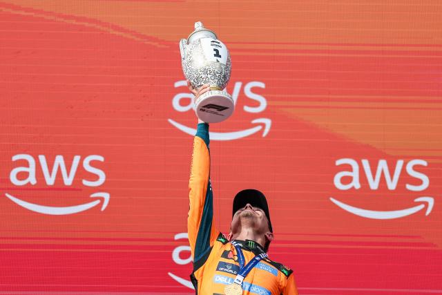 (260727) -- MOGYOROD, July 27, 2026 (Xinhua) -- McLaren's British driver Lando Norris lifts the trophy during the awarding ceremony after the Formula One Hungarian Grand Prix at the Hungaroring in Mogyorod, near Budapest, Hungary, July 26, 2026. (Photo by Bao Di/Xinhua)