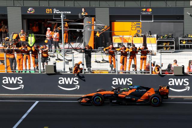 (260727) -- MOGYOROD, July 27, 2026 (Xinhua) -- Teammates react to McLaren's Lando Norris of Britain after winning the race of the Formula One Hungarian Grand Prix at the Hungaroring in Mogyorod, near Budapest, Hungary, July 26, 2026. (Photo by Attila Volgyi/Xinhua)