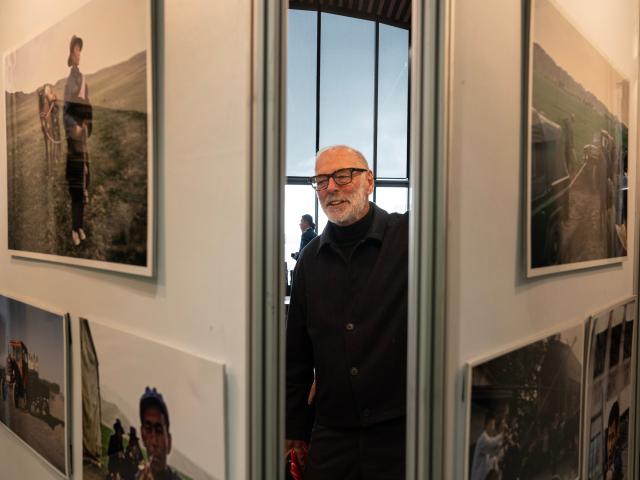 (260727) -- BEIJING, July 27, 2026 (Xinhua) -- A visitor views photos during a photo exhibition marking the legacy of Rewi Alley in Auckland, New Zealand, July 25, 2026. Rewi Alley was a New Zealand-born writer, social reformer and educator, and he spent 60 years living and working in China from 1927 to 1987, when he passed away from illness in Beijing, China's capital. (Photo by Wu Jiaxiang/Xinhua)