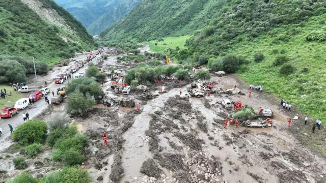 (260727) -- BEIJING, July 27, 2026 (Xinhua) -- An aerial drone photo shows search-and-rescue operations underway at the flood-hit scenic area in Weiyuan County, northwest China's Gansu Province, July 26, 2026.
  A flash flood triggered by sudden heavy rainfall hit a scenic area in northwest China's Gansu Province on Sunday afternoon, leaving 10 people dead and 23 injured as of 6 p.m., local authorities said.
  Some tourists were camping in the scenic area in Weiyuan County, Dingxi City, and were trapped after the flood burst out.
  Local public security and fire-and-rescue departments have dispatched rescue teams to the site, and search-and-rescue operations are underway. (Gansu Fire and Rescue Corps/Handout via Xinhua)