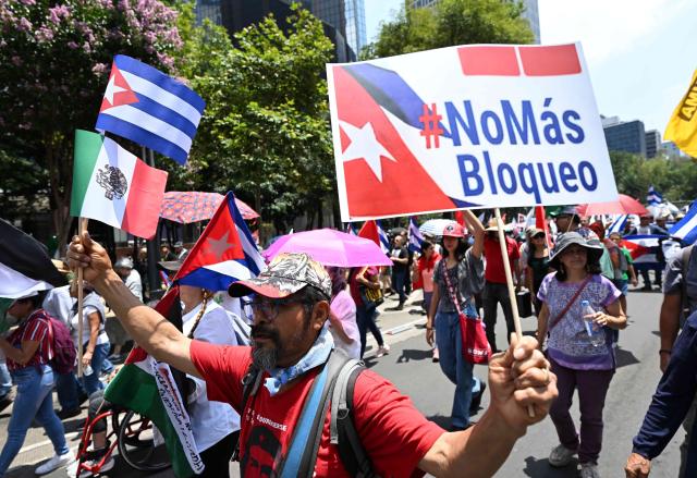 (260727) -- BEIJING, July 27, 2026 (Xinhua) -- Protesters march during a demonstration in support of Cuba and against U.S. embargo on Cuba, in Mexico City, Mexico on July 26, 2026. The demonstration aimed to commemorate the 73rd anniversary of the assault on Moncada and Carlos Manuel de Cespedes garrisons that took place on July 26, 1953, seen as the beginning of the Cuban Revolution. (Xinhua/Wu Wei)