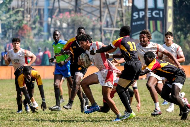 (260727) -- KAMPALA, July 27, 2026 (Xinhua) -- Achraf Hichri (front L) of Tunisia competes during an international U20 rugby test match between Uganda and Tunisia held for the upcoming 2026 Barthes Trophy in Kampala, Uganda on July 26, 2026. The Barthes Trophy, which will take place from August 4 to 17, is the only national-level junior rugby tournament in Africa, with eight U20 teams competing for the title. (Photo by Hajarah Nalwadda/Xinhua)