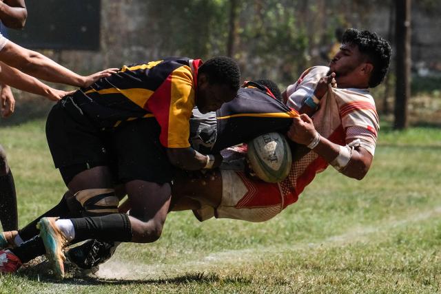 (260727) -- KAMPALA, July 27, 2026 (Xinhua) -- Players compete during an international U20 rugby test match between Uganda and Tunisia held for the upcoming 2026 Barthes Trophy in Kampala, Uganda on July 26, 2026. The Barthes Trophy, which will take place from August 4 to 17, is the only national-level junior rugby tournament in Africa, with eight U20 teams competing for the title. (Photo by Hajarah Nalwadda/Xinhua)