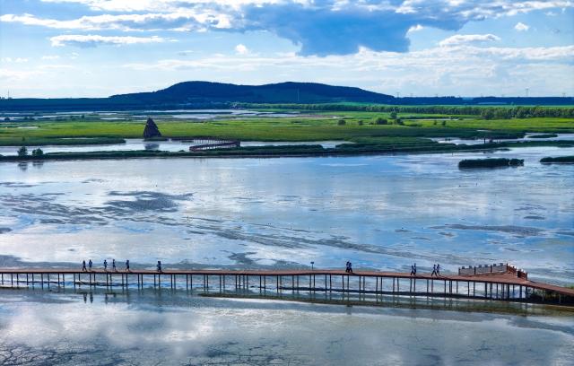 (260727) -- FUJIN, July 27, 2026 (Xinhua) -- A drone photo taken on July 16, 2026 shows a view of the Fujin National Wetland Park in Fujin City, northeast China's Heilongjiang Province. Thanks to years of ecological restoration, the Fujin National Wetland Park now features a thriving ecosystem and breathtaking natural beauty. (Photo by Qu Yubao/Xinhua)