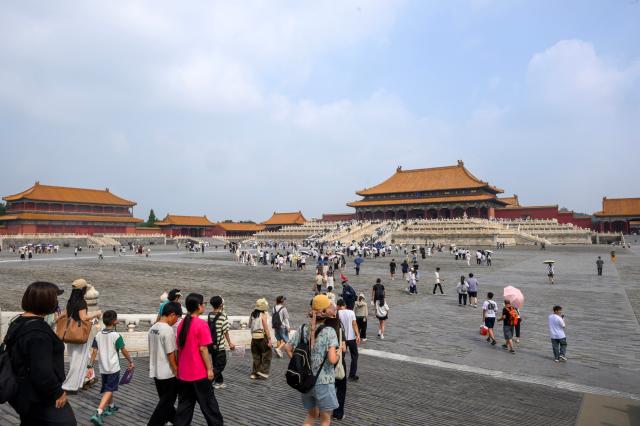 (260727) -- BEIJING, July 27, 2026 (Xinhua) -- People visit the Palace Museum in Beijing, capital of China, July 27, 2026. The Palace Museum opened to the public free of charge on Monday to mark the second anniversary of the successful inscription of the Beijing Central Axis on the UNESCO World Heritage List. (Xinhua/Jin Liangkuai)