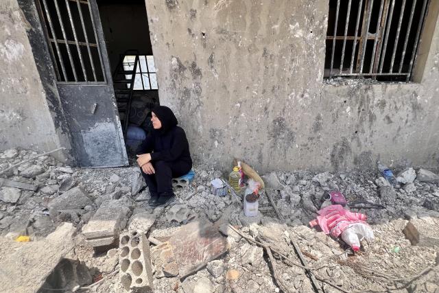 (260727) -- ZAWTAR AL, July 27, 2026 (Xinhua) -- A resident sits beside a damaged house in Zawtar al-Gharbiyah, southern Lebanon, July 26, 2026. The Lebanese army said Sunday that continued Israeli attacks and violations of existing understandings are obstructing its deployment in southern Lebanon and delaying the return of residents to their border villages. (Photo by Ali Hashisho/Xinhua)