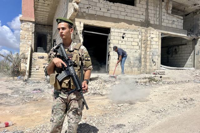 (260727) -- ZAWTAR AL, July 27, 2026 (Xinhua) -- A Lebanese army soldier stands guard as residents return to the town of Zawtar al-Gharbiyah, southern Lebanon, July 26, 2026. The Lebanese army said Sunday that continued Israeli attacks and violations of existing understandings are obstructing its deployment in southern Lebanon and delaying the return of residents to their border villages. (Photo by Ali Hashisho/Xinhua)